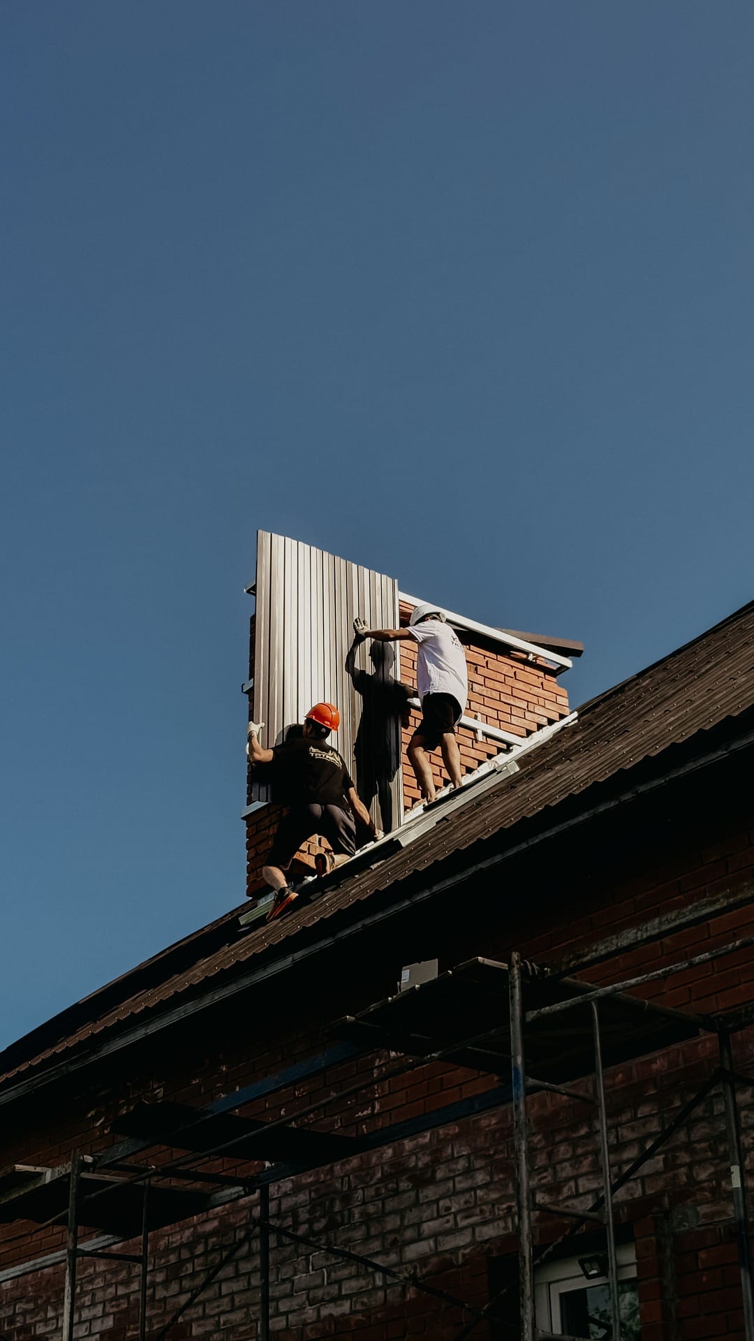 Workers on a roof