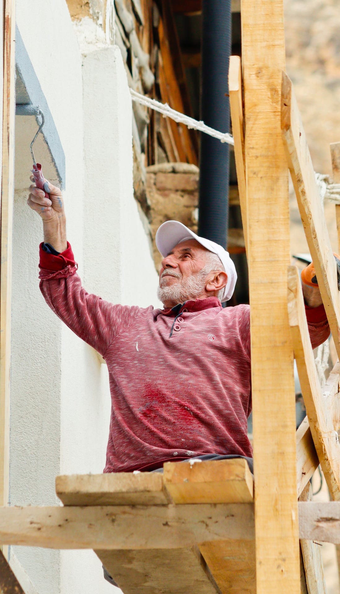 Craftsman painting a facade